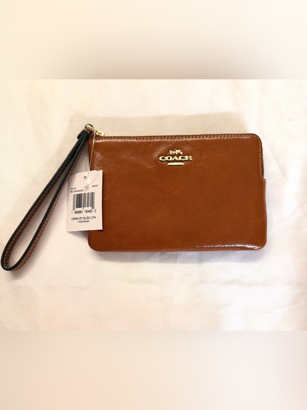 COACH Cinnamon Brown Leather Wristlet with Gold Logo